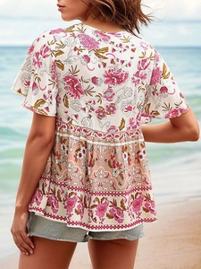 Blouse bohème à fleurs avec basque à volants et lien au dos pour vacances d'été à la plage