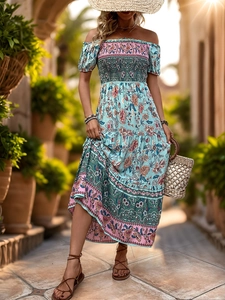 Detail of bohemian floral print dress featuring smocked off-shoulder neckline and bubble sleeves