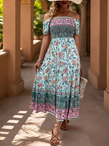 Detail of off-shoulder smocked bodice on a bohemian floral maxi dress with ruffles