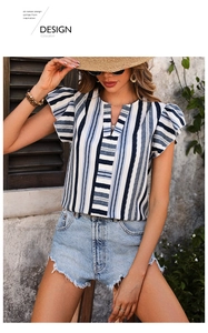 Detail of blue and white striped shirt with ruffle sleeves and V-neckline in summer setting