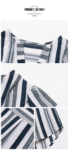 Detail shot of blue striped woven fabric with flutter sleeves and round neckline texture