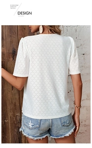 Detailed back view of white eyelet embroidery short sleeve top with geometric patterns