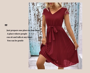 Detail of V-neckline and delicate lace sleeves on this elegant burgundy pleated dress