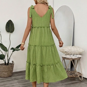 Grass green sleeveless tiered maxi dress with bow shoulder straps and cotton linen texture