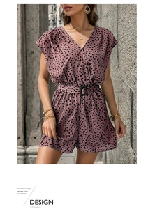 Close-up detail of leopard print romper with V-neckline and waist belt with buckle