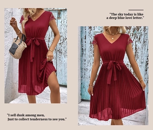 Close-up of wine red summer dress featuring V-neck, lace sleeves, and pleated skirt texture