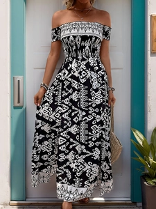 Detailed view of bohemian off-shoulder neckline and smocked bodice on print maxi dress