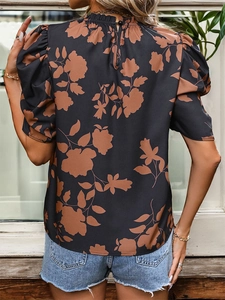 Back view of elegant women's floral puff sleeve blouse with high neck and teardrop cutout