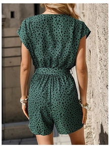 Back view of leopard print summer romper in dark green featuring waist-slimming belt detail