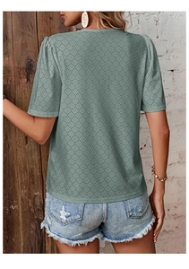 Back view of sage green V-neck T-shirt featuring delicate eyelet embroidery and puff sleeves