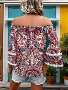 Detail of off-shoulder blouse with ethnic print, bell sleeves and white lace stitching