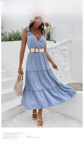 Detail of light blue sleeveless dress with adjustable bow straps and a braided belt