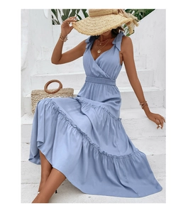 Close-up of the light blue tiered dress with adjustable bow shoulder straps and high waist