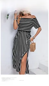 Detail showing the off-shoulder striped dress with waist tie and side split design