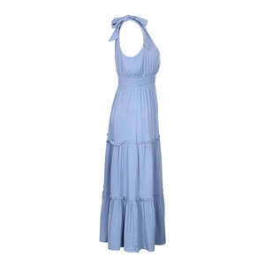 Detail of light blue tiered dress featuring shoulder bow ties and smocked waist design
