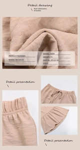 Detail view of high waist drawstring and ruffle hem on nude pink textured trousers