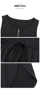 Détails de la robe en maille noire avec fermeture éclair argentée et taille à cordon réglable