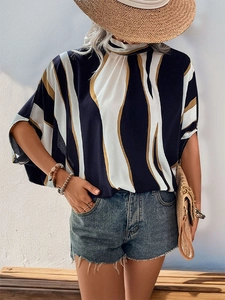 Detail of a casual abstract stripe shirt with a mock neck and loose batwing sleeves