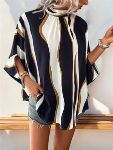 Detail of printed blouse showing loose batwing sleeves and wavy stripe pattern design