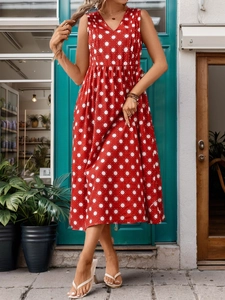 Detail of red sleeveless V-neck maxi dress with white star print on cotton blend fabric