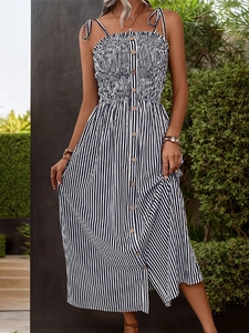 Detail of blue striped midi dress with smocked bodice and wooden buttons on the front