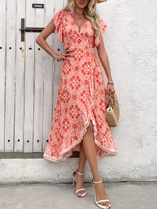 Detail of red floral wrap dress with V-neck ruffle sleeves and asymmetrical hem
