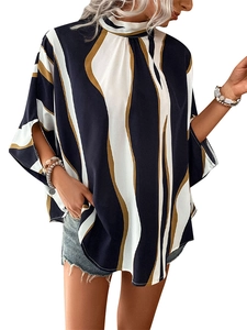 Detail view of batwing sleeves with side slits on a vertical striped printed blouse