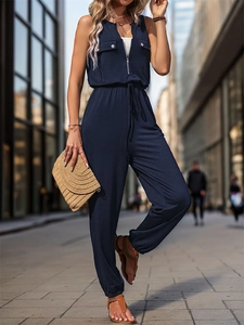 Detail of navy blue sleeveless jumpsuit with V-neck zipper and drawstring waist
