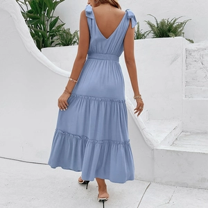 Light blue backless maxi dress with tiered skirt and bow straps for summer vacation