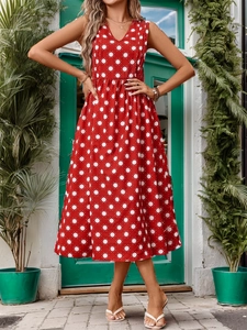 Detail of red sleeveless A-line dress with white sunburst print and V-neckline