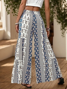 Detail of high waisted bohemian wide leg pants featuring mixed ethnic prints and ruffles