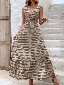 Detailed view of women's sleeveless dress with geometric diamond print and ruffled hem