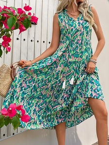 Bohemian sleeveless maxi dress with vibrant floral print and tassel V-neck for summer vacations