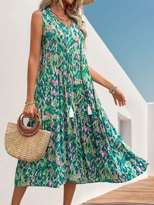 Bohemian sleeveless V-neck maxi dress with vibrant abstract print and tassel details