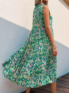 Bohemian tiered maxi dress with green and pink abstract leopard print for summer vacation