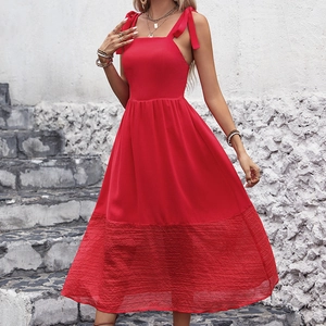 Elegant red sleeveless midi dress with tie shoulder straps and textured hem design