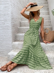 Detail of V-neck sleeveless summer dress with green diamond print and drawstring waist