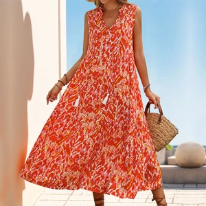 Detail of V-neckline with tassel ties on a bohemian tiered sleeveless summer maxi dress