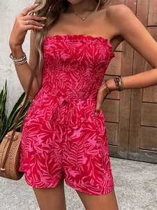 Detail of red tropical leaf print romper with elastic shirred bodice and high waist
