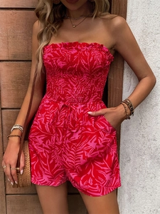 Detail of red tropical print strapless romper with smocked top and drawstring waist