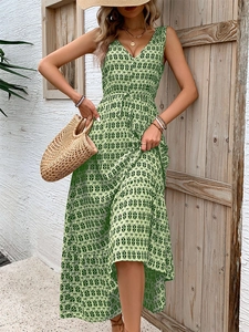Close-up of green geometric diamond print and V-neckline on sleeveless summer midi dress