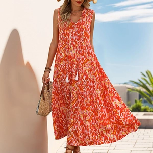 Detail of bohemian floral print dress with V-neckline and white tassel drawstring ties