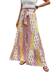 Detail of high-waist floral wide-leg pants featuring mixed patchwork patterns and a waist tie