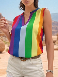 Close-up of women's V-neck sleeveless top with colorful vertical rainbow stripes texture