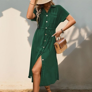 Detail of dark green lapel shirt dress showing the drawstring waist and button closure