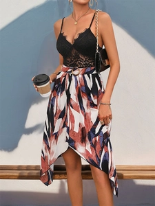 Detail of eyelash lace top and high waist irregular skirt with geometric abstract print