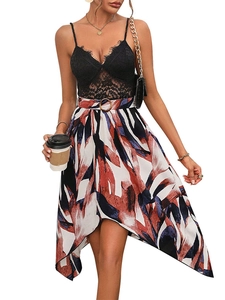 Detailed view of black lace V-neck bodice with irregular abstract print midi skirt