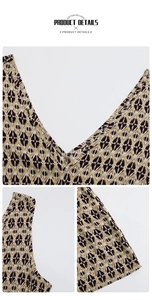 Detailed view of the V-neckline and retro diamond geometric print on a sleeveless dress