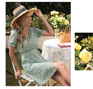Close-up of green floral V-neck dress with puff sleeves and cinched waist design