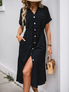 Detail of black summer shirt dress showing natural cotton-linen texture and waist drawstring